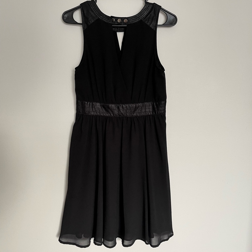 Charming Charlie’s Black cross front dress with pho leather accent
